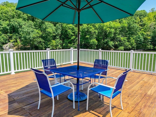 285 Dixon Dr, Hardy, VA 24101 - wooden deck with outdoor dining area, a view of trees, and a lawn