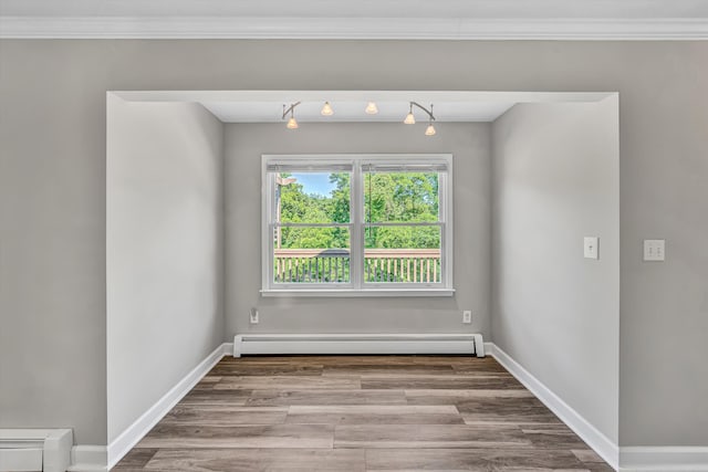 395 Middle Valley Rd, Hardy, VA 24101 - spare room featuring a baseboard radiator, ornamental molding, wood finished floors, and baseboards