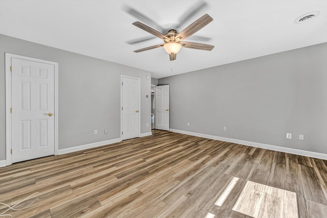 395 Middle Valley Rd, Hardy, VA 24101 - unfurnished bedroom with baseboards, wood finished floors, and ceiling fan