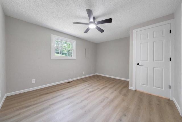 1632 Haymakertown Rd, Troutville, VA 24175 - unfurnished bedroom featuring a textured ceiling, light wood-type flooring, baseboards, and a ceiling fan