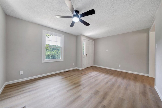 1632 Haymakertown Rd, Troutville, VA 24175 - unfurnished room with a textured ceiling, wood finished floors, ceiling fan, and baseboards