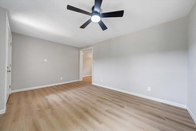 1632 Haymakertown Rd, Troutville, VA 24175 - unfurnished room with light wood finished floors, a textured ceiling, a ceiling fan, and baseboards