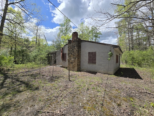 115 Wrights Branch Rd, New Castle, VA 24127 - view of home's exterior with a chimney and concrete block siding
