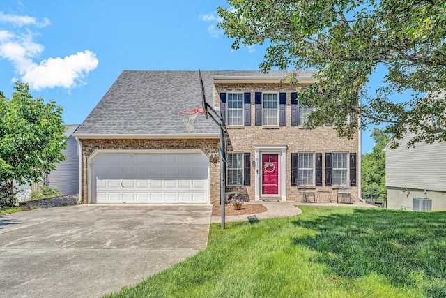 6131 Carolina Trl, Roanoke, VA 24019 - colonial-style house featuring driveway, a garage, a front lawn, brick siding, and a shingled roof