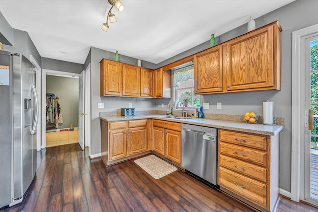 6131 Carolina Trl, Roanoke, VA 24019 - kitchen with stainless steel appliances, a sink, dark wood-style floors, and light countertops