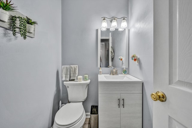 6131 Carolina Trl, Roanoke, VA 24019 - bathroom with vanity, toilet, and baseboards