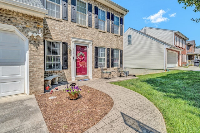 6131 Carolina Trl, Roanoke, VA 24019 - property entrance with a lawn and a garage
