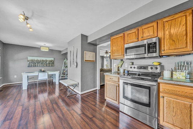 6131 Carolina Trl, Roanoke, VA 24019 - kitchen with appliances with stainless steel finishes, dark wood-style floors, baseboards, and brown cabinetry
