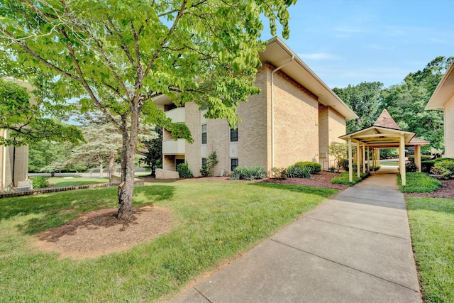 5260 Crossbow Cir Unit 9E, Roanoke, VA 24018 - view of side of home with a lawn and stucco siding