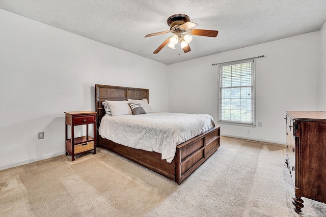 5260 Crossbow Cir Unit 9E, Roanoke, VA 24018 - bedroom featuring light carpet, baseboards, a textured ceiling, and a ceiling fan