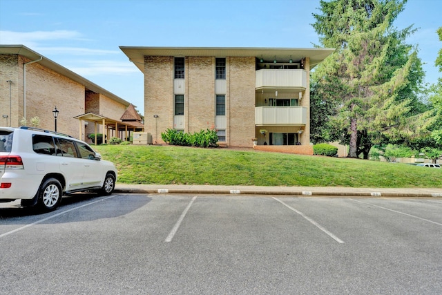 5260 Crossbow Cir Unit 9E, Roanoke, VA 24018 - view of building exterior with uncovered parking