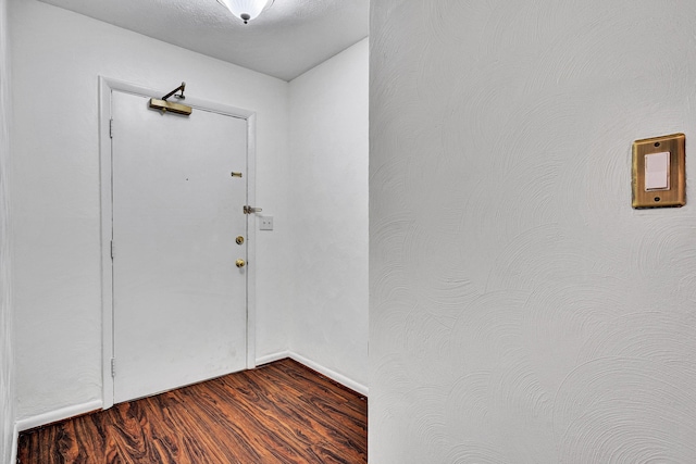 5260 Crossbow Cir Unit 9E, Roanoke, VA 24018 - foyer entrance featuring dark wood-style flooring and baseboards