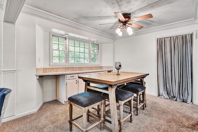 5260 Crossbow Cir Unit 9E, Roanoke, VA 24018 - dining area with light colored carpet, ornamental molding, ceiling fan, and baseboards