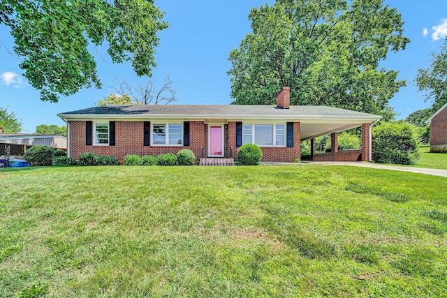 2527 Northminster Rd NW, Roanoke, VA 24012 - ranch-style home with a chimney, a carport, driveway, and a front yard