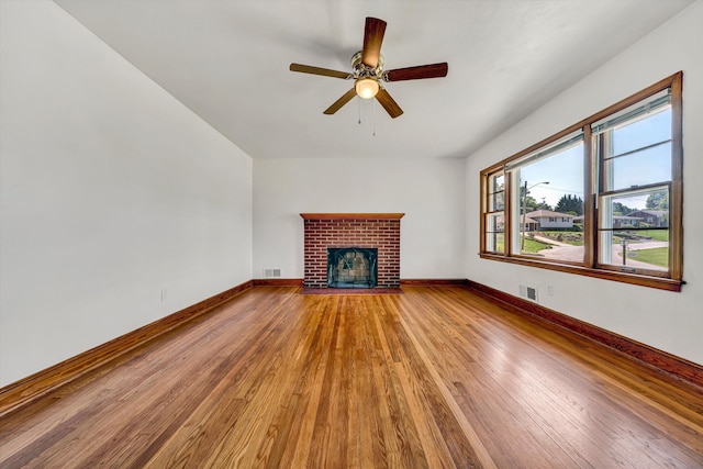 2527 Northminster Rd NW, Roanoke, VA 24012 - unfurnished living room with wood finished floors, a fireplace, baseboards, and a ceiling fan