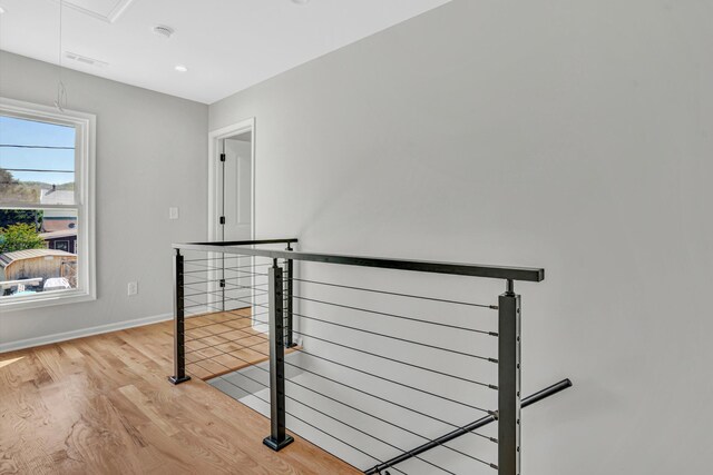 702 Commerce Ave, Iron Gate, VA 24448 - corridor featuring light wood-style flooring, baseboards, attic access, and recessed lighting