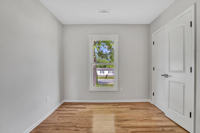 702 Commerce Ave, Iron Gate, VA 24448 - spare room featuring light wood-style flooring and baseboards