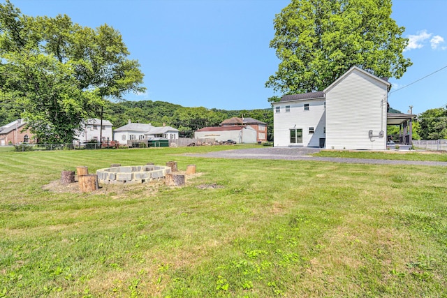 702 Commerce Ave, Iron Gate, VA 24448 - view of yard with an outdoor fire pit