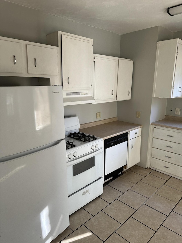 605 6th St SE, Roanoke, VA 24013 - kitchen featuring white appliances, under cabinet range hood, white cabinetry, and light tile patterned floors