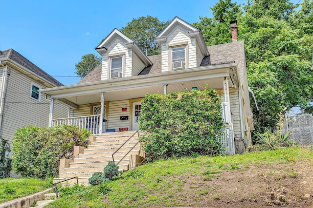 605 6th St SE, Roanoke, VA 24013 - view of front facade with a porch, a chimney, stairs, and a shingled roof