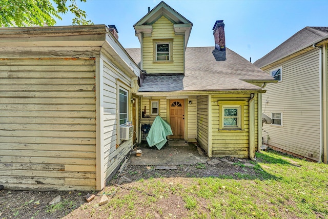 605 6th St SE, Roanoke, VA 24013 - rear view of property with roof with shingles, a chimney, and cooling unit