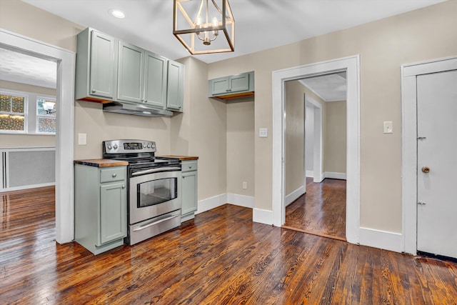 1132 Hamilton Ave SW, Roanoke, VA 24015 - kitchen featuring electric range, under cabinet range hood, wood counters, dark wood-type flooring, and a chandelier