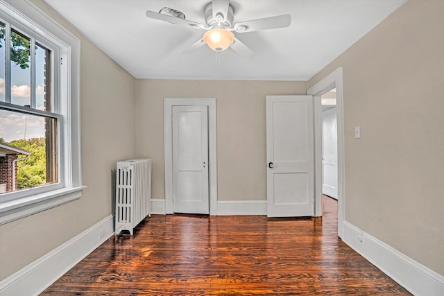 1132 Hamilton Ave SW, Roanoke, VA 24015 - unfurnished bedroom with radiator, wood finished floors, and ceiling fan