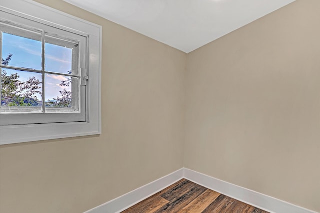 1132 Hamilton Ave SW, Roanoke, VA 24015 - unfurnished room with baseboards and dark wood-style floors