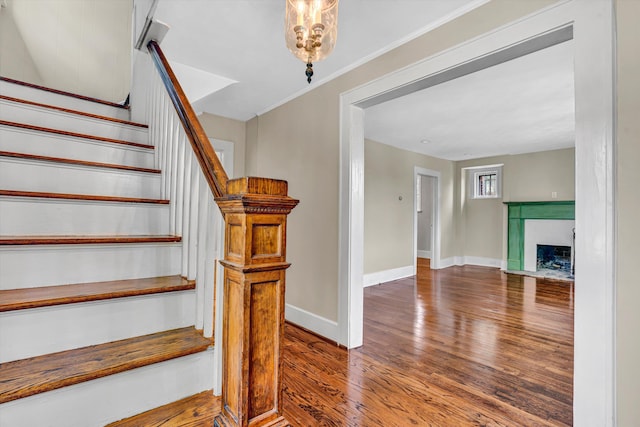 1132 Hamilton Ave SW, Roanoke, VA 24015 - stairs featuring wood finished floors and a brick fireplace
