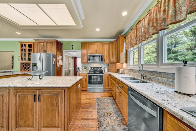 6355 Juliet Ct, Roanoke, VA 24018 - kitchen featuring appliances with stainless steel finishes, a sink, ornamental molding, light wood finished floors, and light stone counters