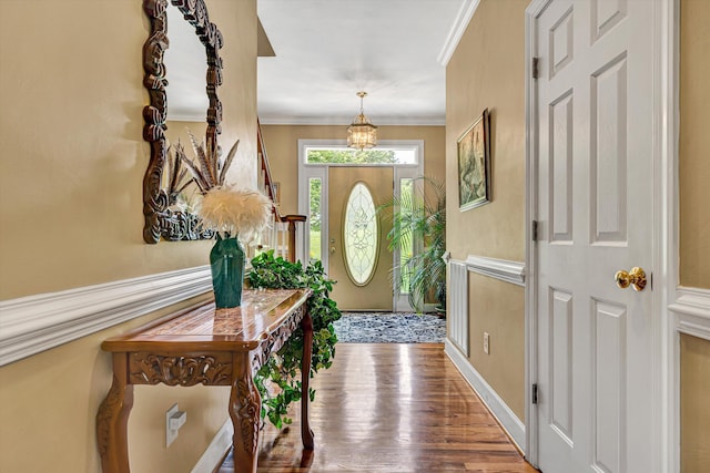 6355 Juliet Ct, Roanoke, VA 24018 - foyer featuring wood finished floors, a chandelier, ornamental molding, and baseboards