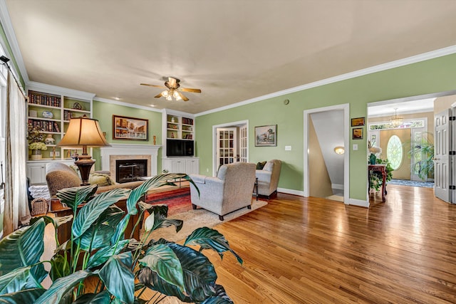 6355 Juliet Ct, Roanoke, VA 24018 - living area with a ceiling fan, light wood finished floors, ornamental molding, built in shelves, and baseboards