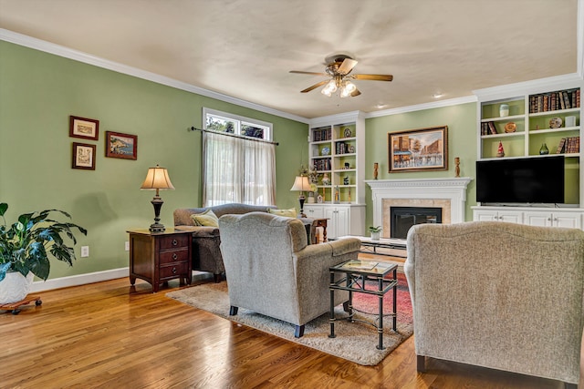 6355 Juliet Ct, Roanoke, VA 24018 - living room featuring a ceiling fan, wood finished floors, crown molding, baseboards, and a glass covered fireplace