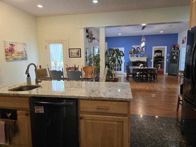 6733 Floyd Hwy S, Willis, VA 24380 - kitchen featuring dishwasher, a sink, black refrigerator with ice dispenser, light stone counters, and recessed lighting