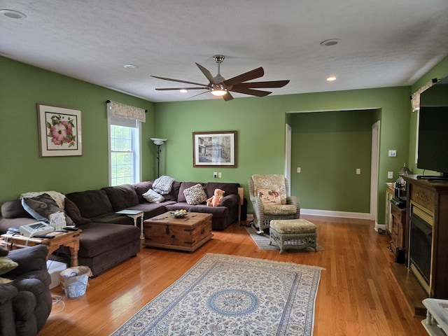 6733 Floyd Hwy S, Willis, VA 24380 - living room featuring wood finished floors, a ceiling fan, a fireplace, recessed lighting, and baseboards