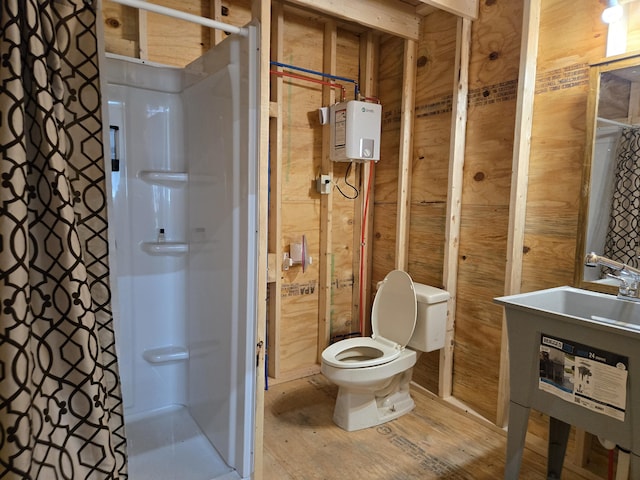 6733 Floyd Hwy S, Willis, VA 24380 - full bathroom with a stall shower, toilet, wood finished floors, and wooden walls