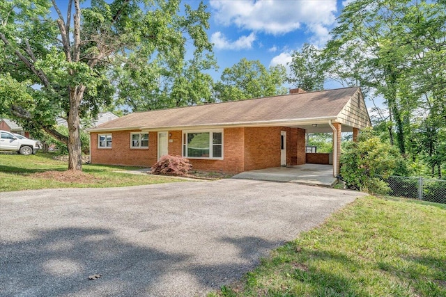 3271 Rasmont Rd, Roanoke, VA 24018 - single story home featuring driveway, brick siding, an attached carport, and a chimney