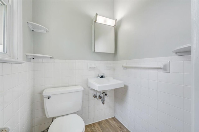 3271 Rasmont Rd, Roanoke, VA 24018 - bathroom featuring toilet, tile walls, a wainscoted wall, and wood finished floors