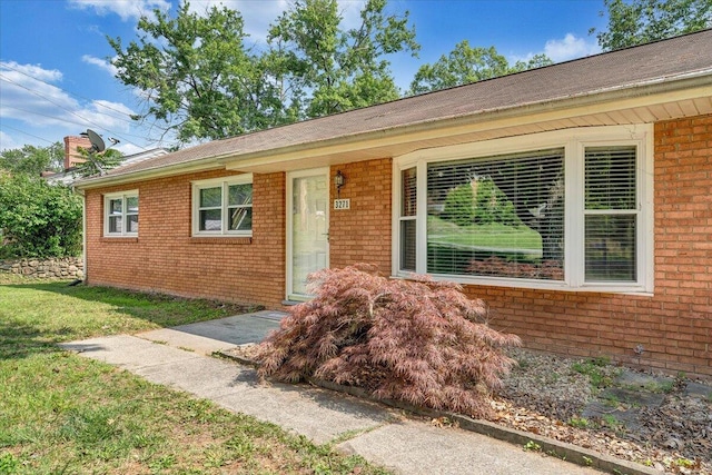 3271 Rasmont Rd, Roanoke, VA 24018 - view of front of home with brick siding, a chimney, and a front lawn