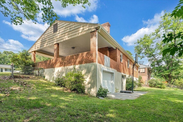 3271 Rasmont Rd, Roanoke, VA 24018 - view of side of home with a chimney, an attached garage, and brick siding