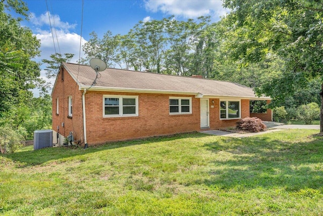 3271 Rasmont Rd, Roanoke, VA 24018 - ranch-style house with cooling unit, a front lawn, and brick siding