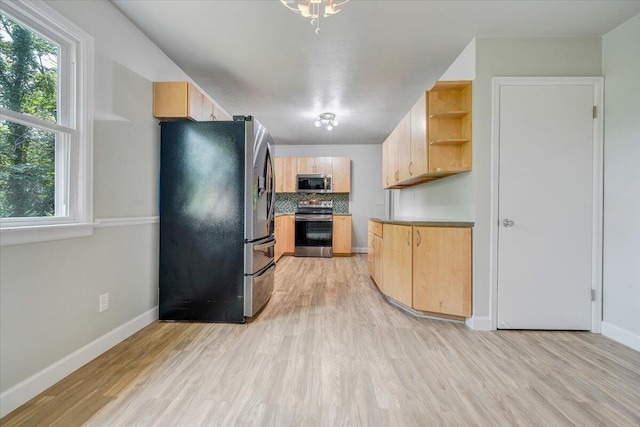 3271 Rasmont Rd, Roanoke, VA 24018 - kitchen with stainless steel appliances, light brown cabinets, open shelves, and light wood-style flooring