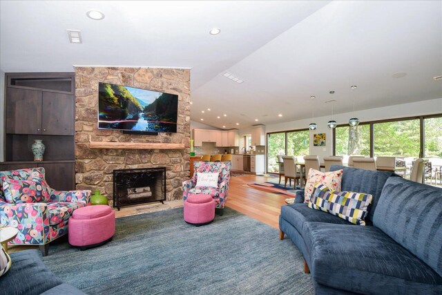 569 Sprinkle Rd, Fincastle, VA 24090 - kitchen featuring open floor plan, vaulted ceiling, healthy amount of natural light, and light wood-style floors