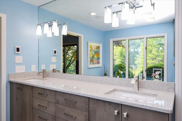 569 Sprinkle Rd, Fincastle, VA 24090 - half bathroom featuring vanity, toilet, healthy amount of natural light, and baseboards