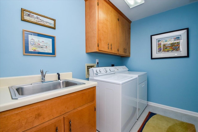 569 Sprinkle Rd, Fincastle, VA 24090 - laundry area with washer and dryer, cabinet space, light tile patterned flooring, and baseboards