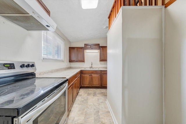 1046 Silverwood Rd NW, Roanoke, VA 24017 - kitchen with electric stove, ventilation hood, light countertops, stone finish floors, and brown cabinetry