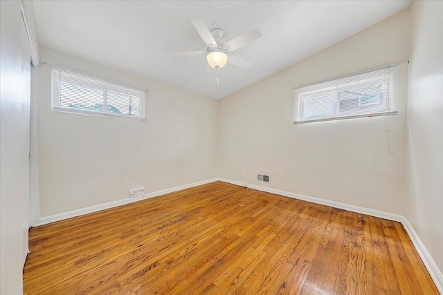1046 Silverwood Rd NW, Roanoke, VA 24017 - unfurnished room with plenty of natural light, light wood-style flooring, a ceiling fan, and lofted ceiling