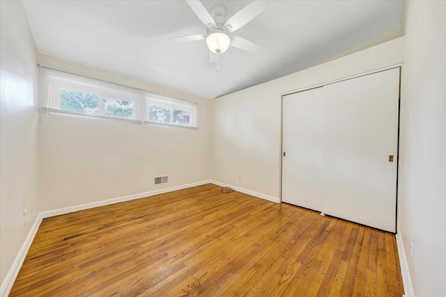 1046 Silverwood Rd NW, Roanoke, VA 24017 - unfurnished bedroom with wood finished floors, ceiling fan, and a closet