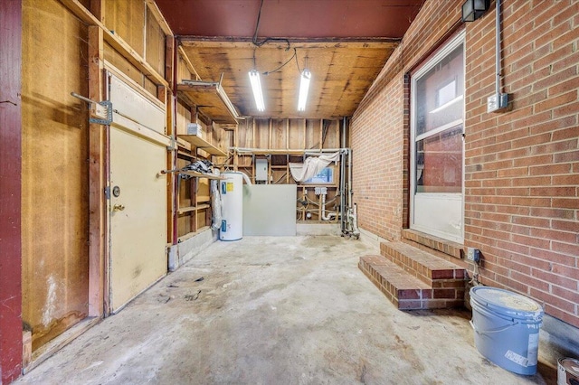1046 Silverwood Rd NW, Roanoke, VA 24017 - basement featuring water heater and brick wall