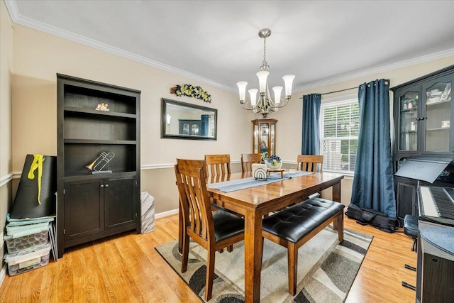 201 Jay Ridge Rd, Cloverdale, VA 24077 - dining room featuring crown molding, a chandelier, light wood-type flooring, and baseboards